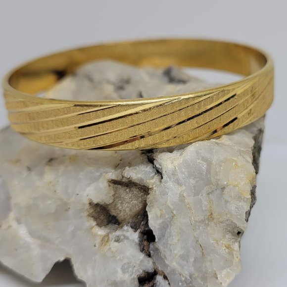 Monet stunning gold tone bangle bracelet